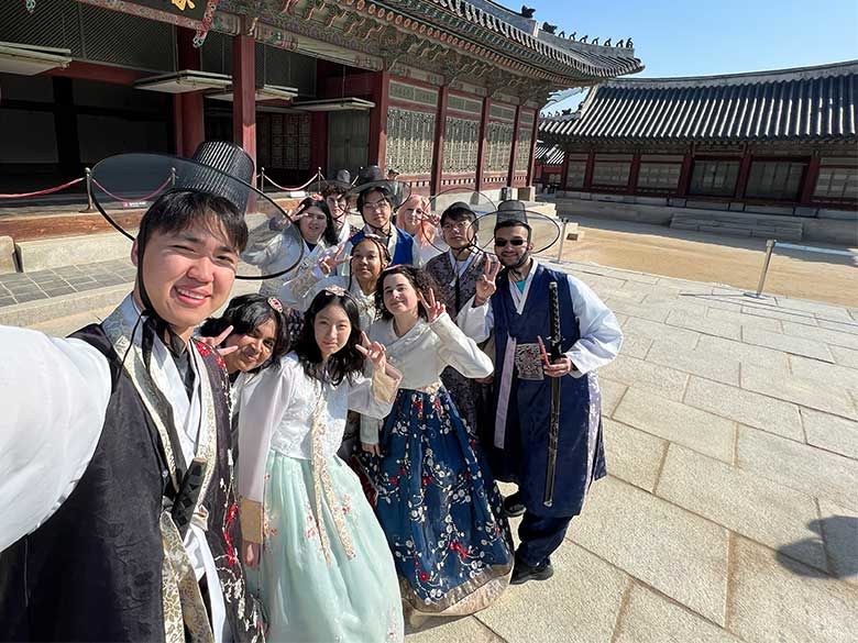 Group of students smile for photo in South Korea