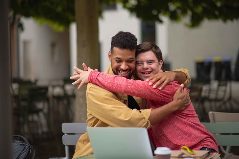 two people hugging 