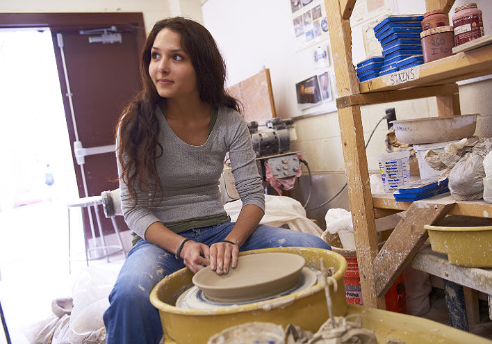 woman working with pottery