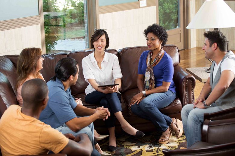 group discussion with everyone sitting and talking