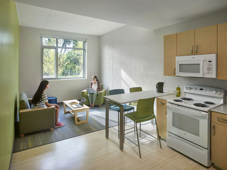 two student sitting in living room