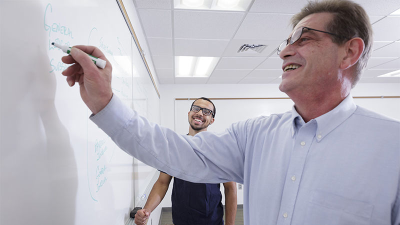 Penn State Abington (near Philadelphia) professor writing on whiteboard