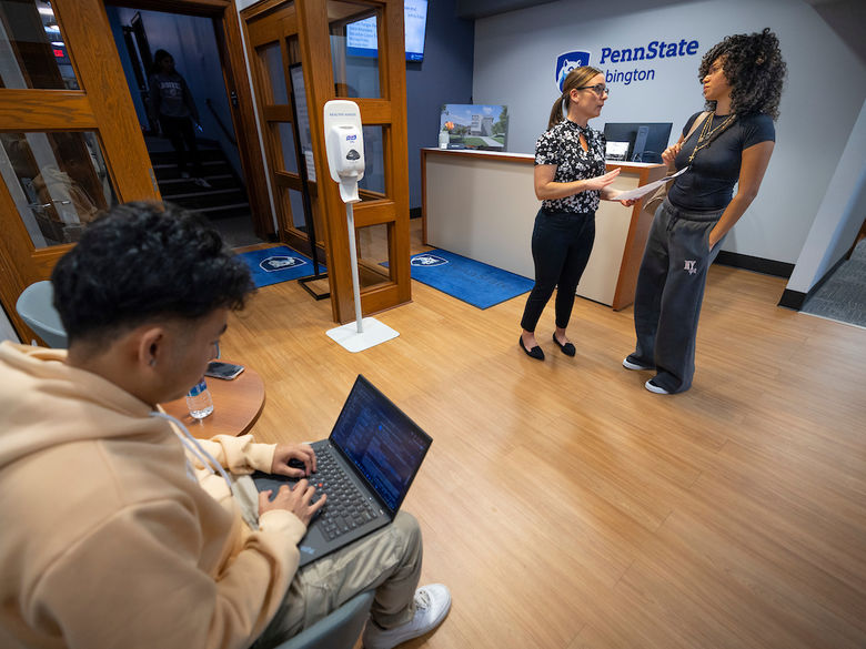 two students in the Penn State Abington admissions office near Philadelphia