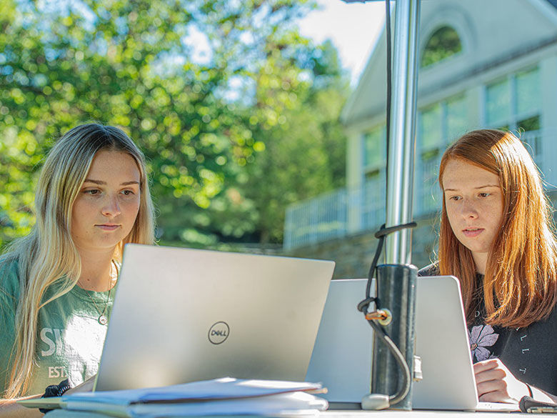 students at work with laptops