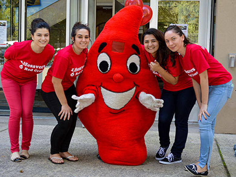students and blooddrop mascot