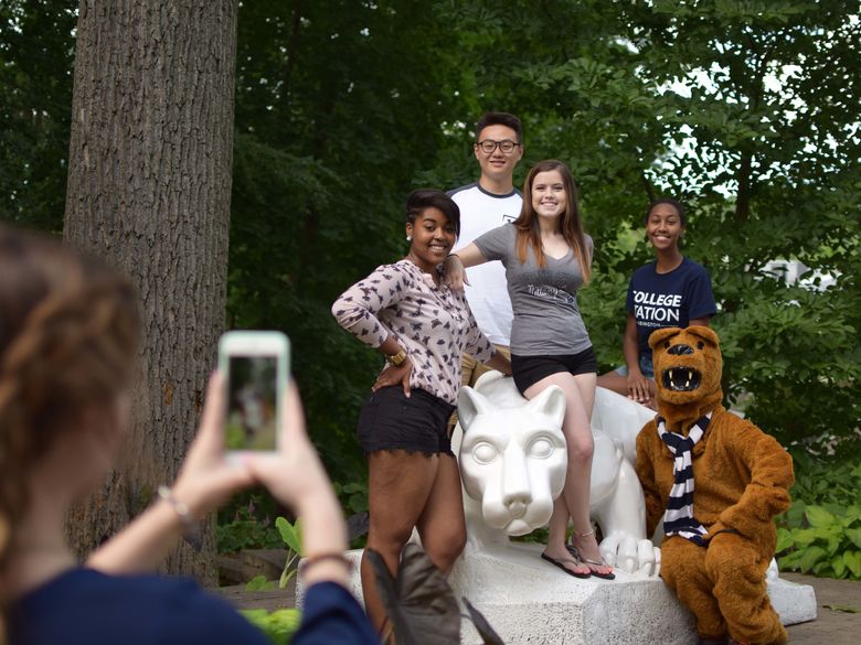 Students pose for a photo at the Lion Shrine