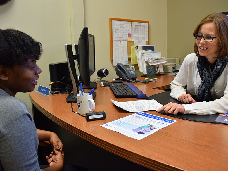 student with financial aid officer