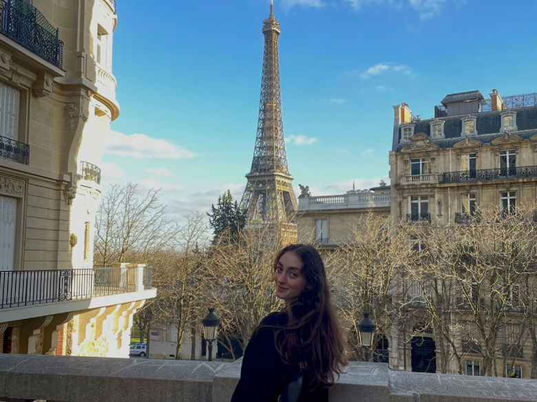 Student in front of Eiffel Tower 