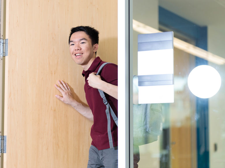 student walking in the door