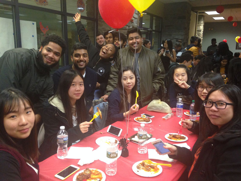 Students smiling for group photo at Lions Gate Event