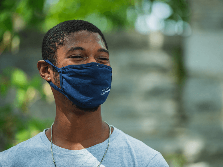 student with a mask on