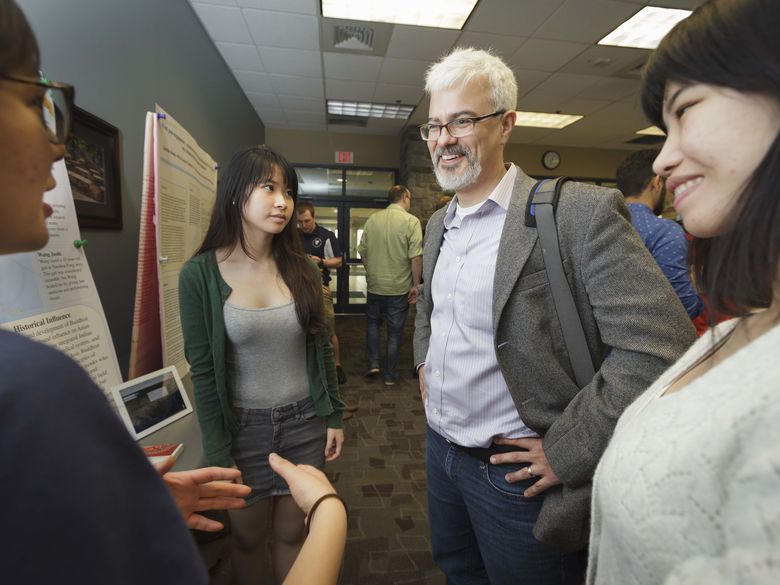 Professor talking to students