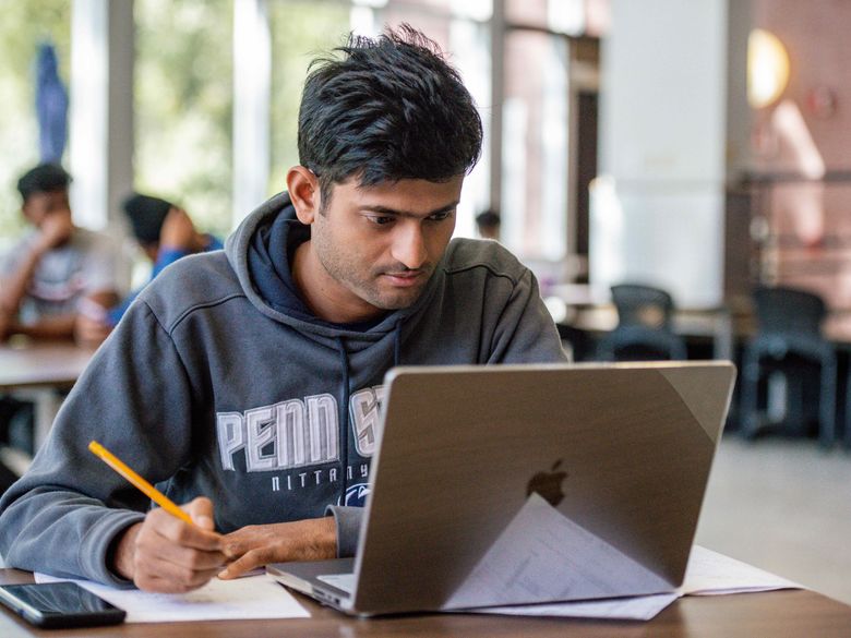 student with laptop at Penn State Abington (near Philadelphia)