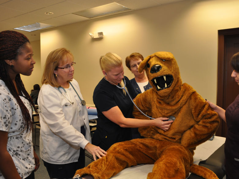 Nittany Lion getting checked out by Nurses