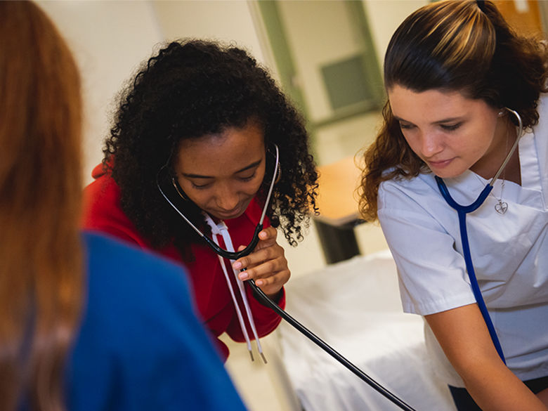 nursing student with patient