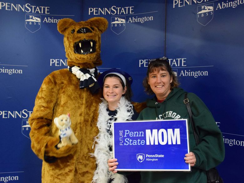 Mother and daughter posing with Nittany lion 