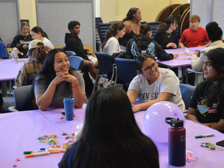 Penn State Abington (near Philadelphia) students at sister2sister event sitting at tables
