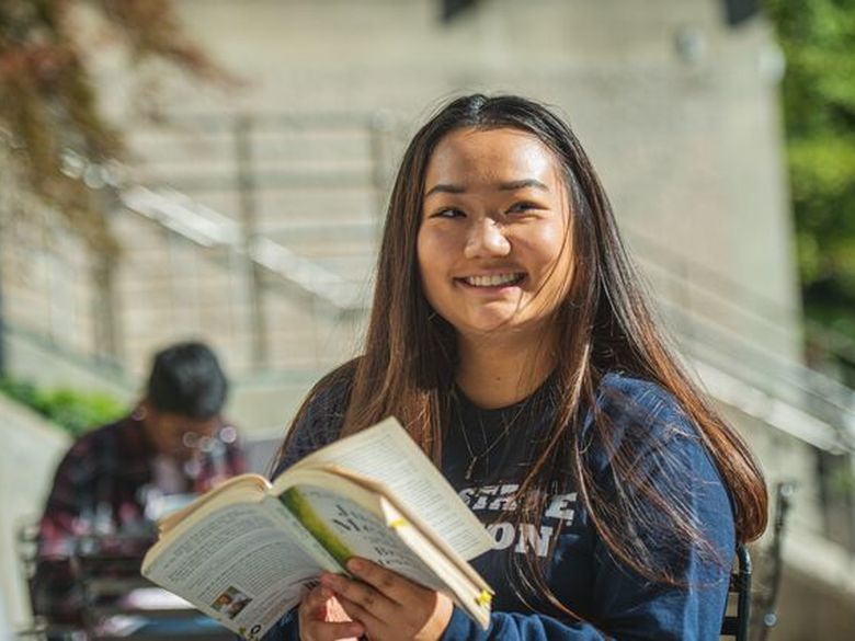 A student reads a book at Penn State Abington (near Philadelphia)