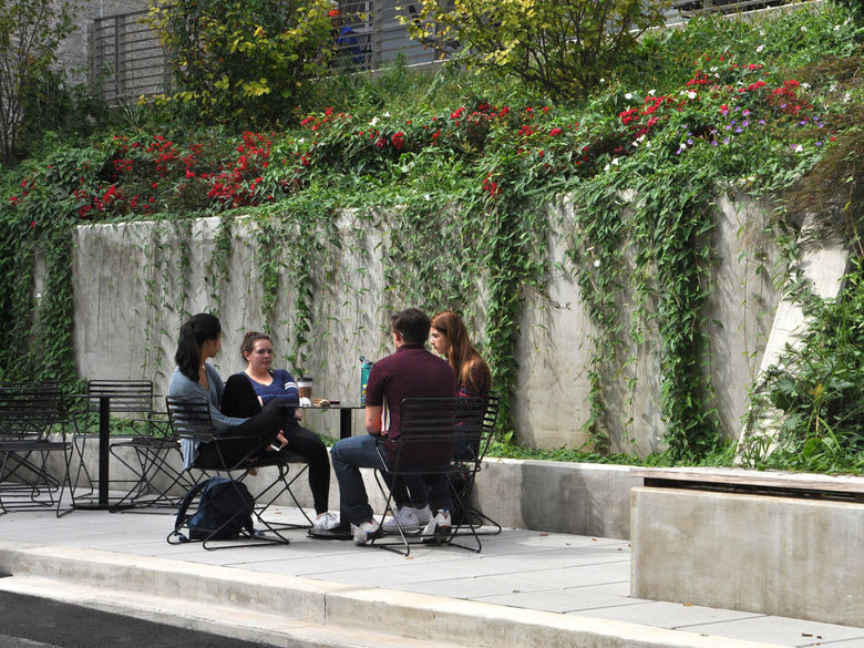 students on campus sitting at a table
