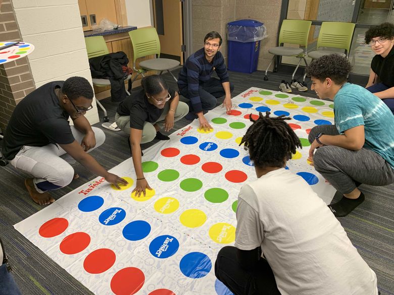 Student playing Twister in Lions Gate