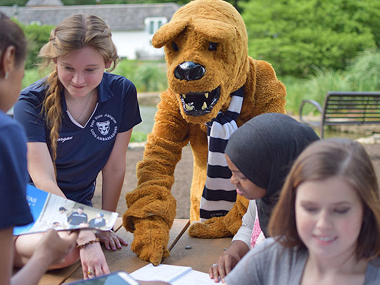 Lion helping students at the pond