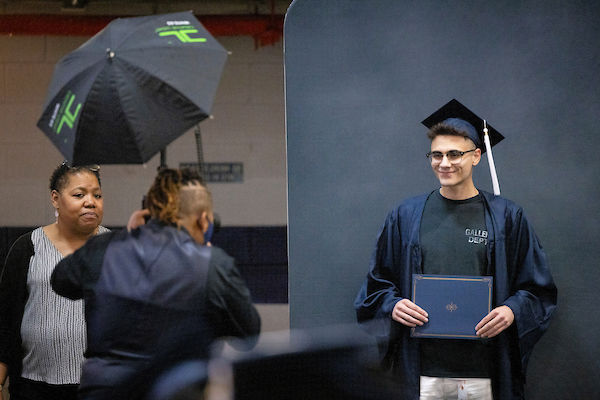 photographer taking a photo of a student