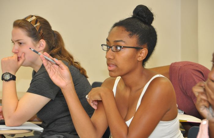 Student pointing at board