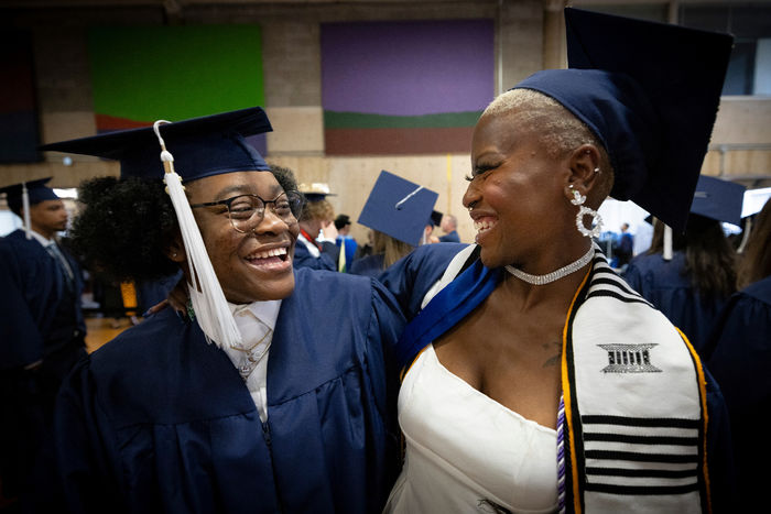 Two women in caps and gowns