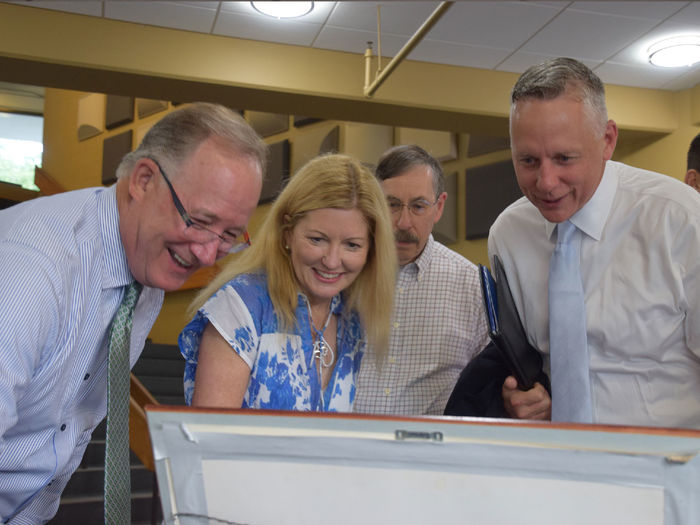 People looking at documents