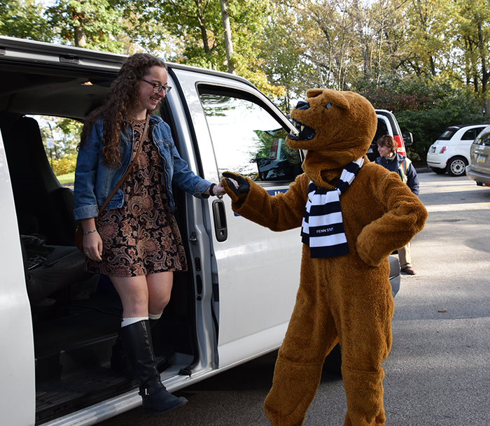 Student getting off shuttle 