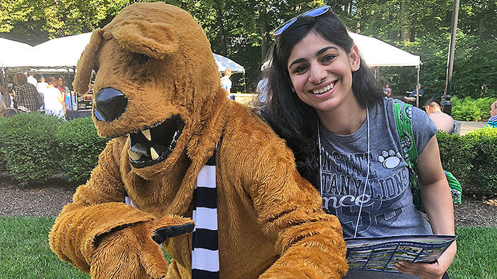 Nittany lion and woman student
