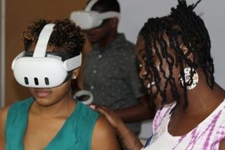 Two people, one in a VR headset
