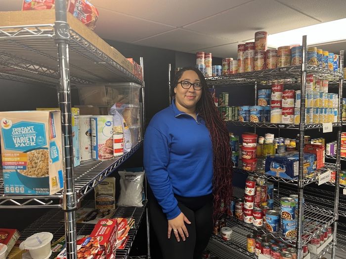 Student standing inside LionShare Pantry 