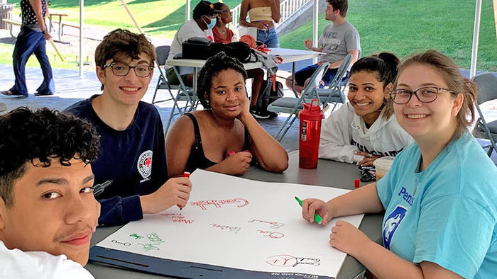 five students around a table