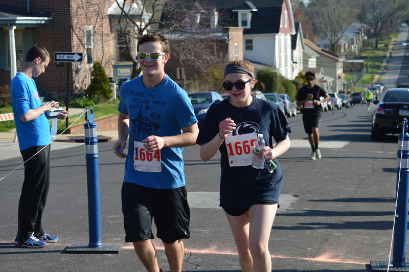 male and female running in a 5k race