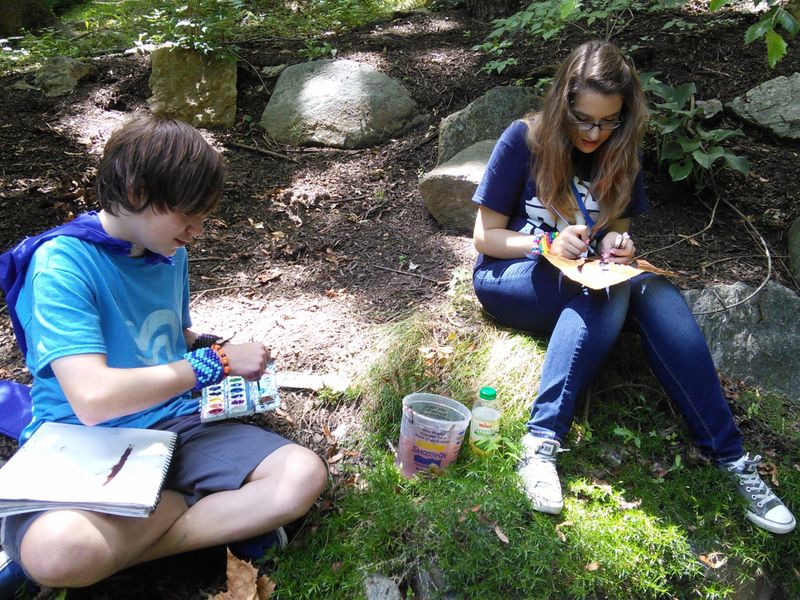 Students drawing outside