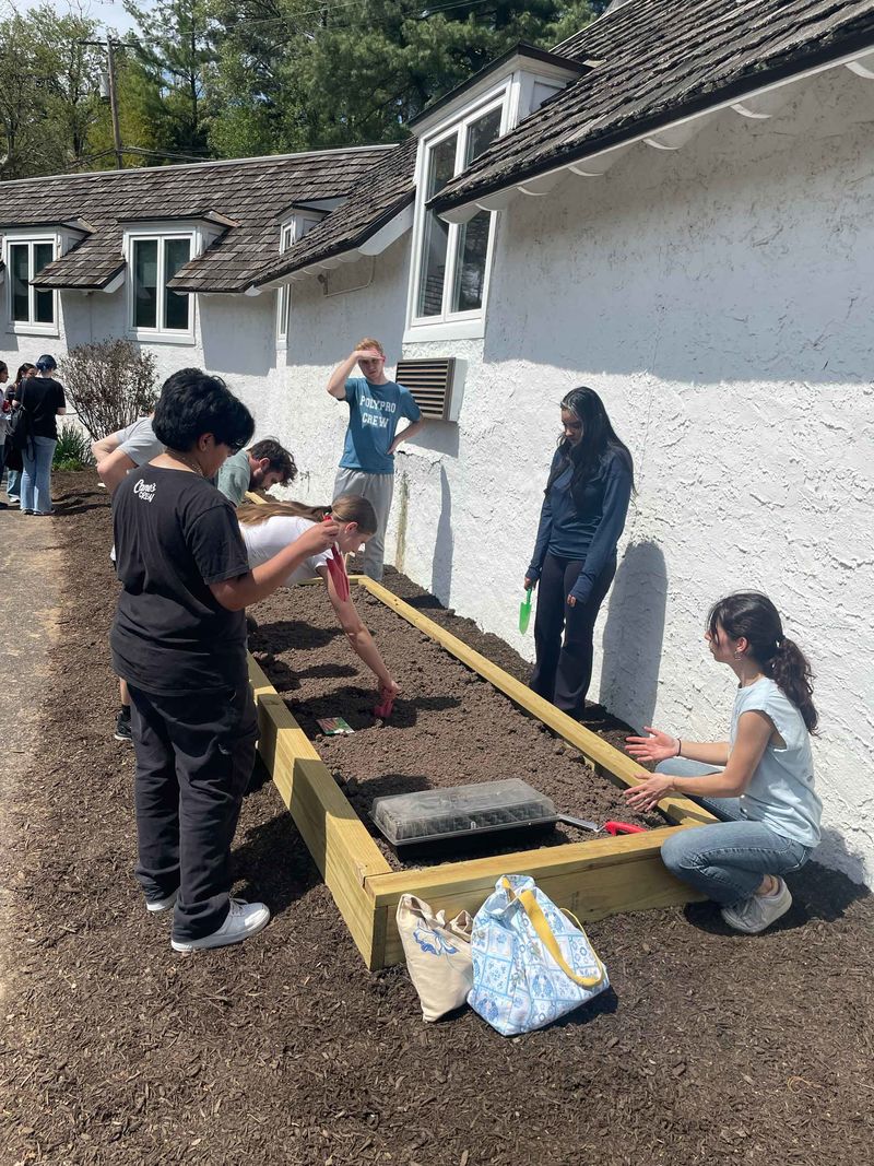 Students working on a garden box