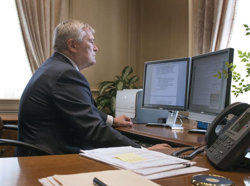 Eric Barron at his desk during his first morning as Penn State president