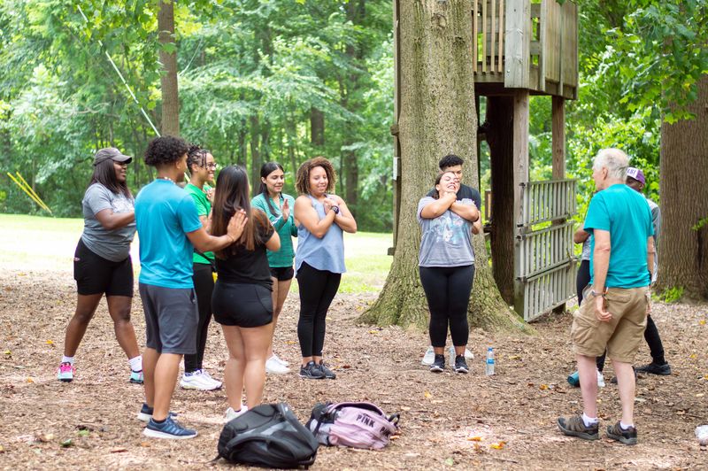 group of students doing trust fall exercise 