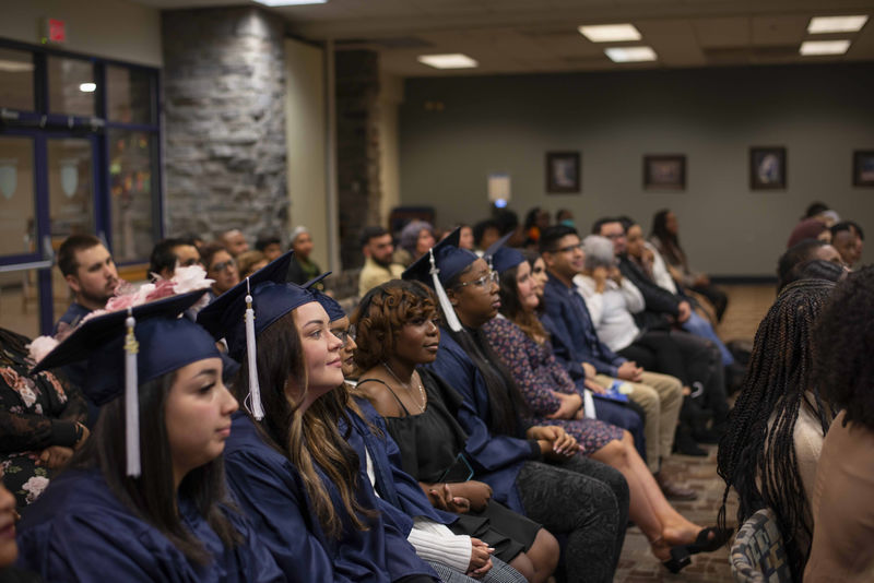 students sitting at ceremony