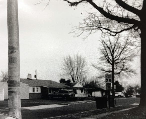 black and white photograph of a neighborhood