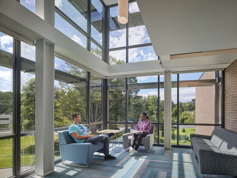 Lions Gate south lounge with students sitting on couches 