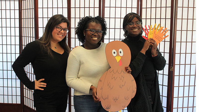 students holding a turkey