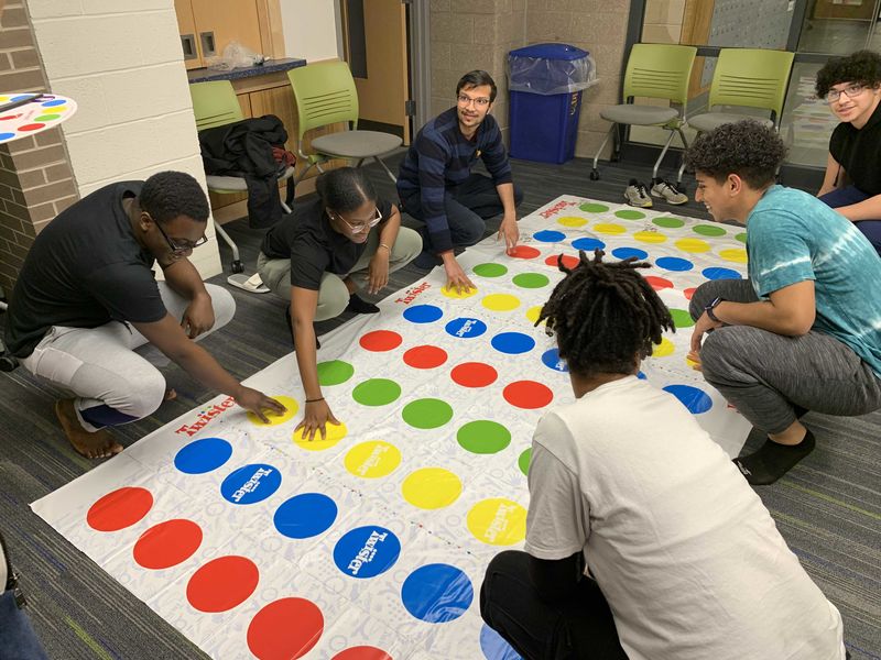 students playing twister in Lions Gate lounge