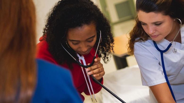 Nurses checking a patient