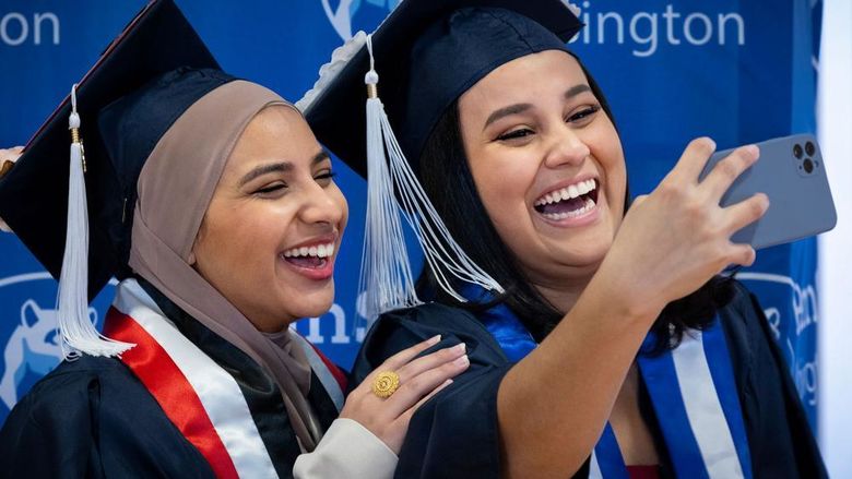 Two new Penn State Abington graduates take a selfie