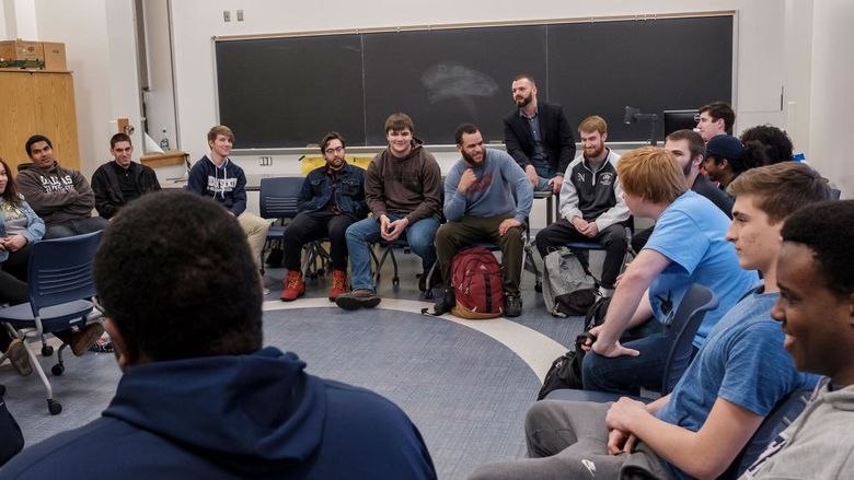 Students sitting in a circle in a classroom