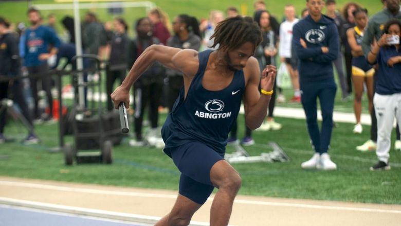 Student running in a track meet