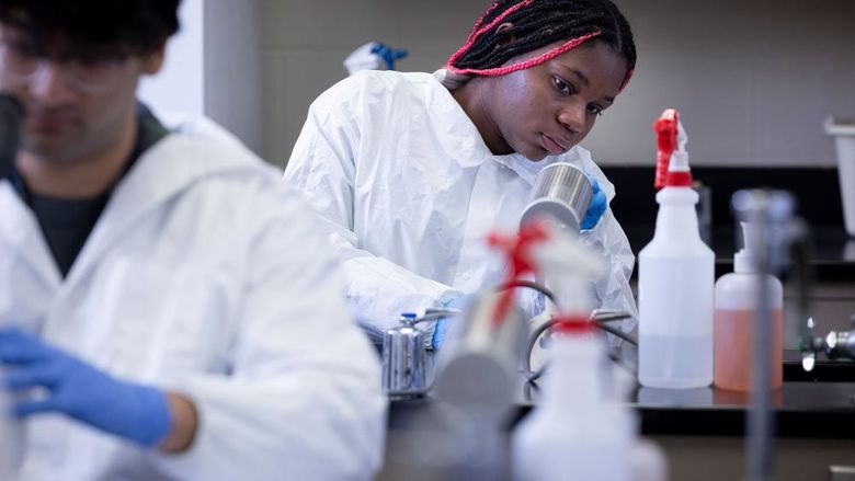 Student in a college laboratory