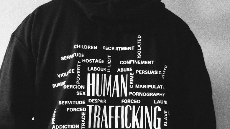 Person showing the back of their hoodie 